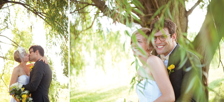 Bride and groom kissing under willow tree in quad city- illinois wedding